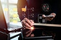 An IT specialist is installing a Document Management System (DMS) on a laptop computer for a multitasking businessman