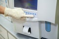 The specialist of the laboratory displays the data on the composition of blood components after processing in a special apparatus Royalty Free Stock Photo