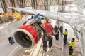 Specialist mechanic repairs the maintenance of a large engine of a passenger aircraft in a hangar. Russia. Moscow. 28 november Royalty Free Stock Photo