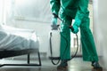 Specialist spraying chemicals from portable tank stock photo