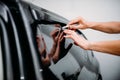 Specialist work with car, tinting film installing Royalty Free Stock Photo