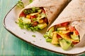 Speciality tortilla wraps with nachos and avocado