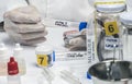 Specialized criminalistic police performs hematological analysis with forensic test kit in a murder in a crime lab