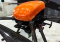 specialized industrial drone with red body with suspension close-up, selective focus, depth of field