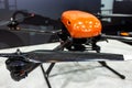 specialized industrial drone with red body with suspension close-up, selective focus, depth of field