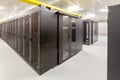 Network servers in a data center. Tier III carrier neutral data center. Server rooms.