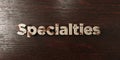 Specialties - grungy wooden headline on Maple - 3D rendered royalty free stock image