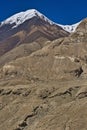 Specific Himalayan Karakoram landscape with deep valleys, arid landscape and peaks over 7000 and 8000m full of snow with walls sti