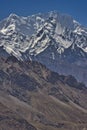 Specific Himalayan Karakoram landscape with deep valleys, arid landscape and peaks over 7000 and 8000m full of snow with walls sti Royalty Free Stock Photo