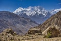 Specific Himalayan Karakoram landscape with deep valleys, arid landscape and peaks over 7000 and 8000m full of snow with walls sti Royalty Free Stock Photo