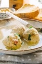 Dumplings cooked in broth on a laden table