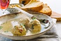 Dumplings cooked in broth on a laden table Royalty Free Stock Photo