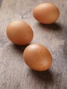 Speckled chicken eggs on old table Royalty Free Stock Photo