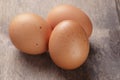 Speckled chicken eggs on old table Royalty Free Stock Photo