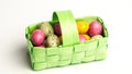 Speckled colourful easter eggs in a green basket Royalty Free Stock Photo