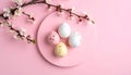 Speckled pastel Easter eggs on a pink circular plate with cherry blossoms spring Royalty Free Stock Photo