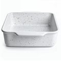 Speckled square baking dish with minimalist design for culinary creations on white background Royalty Free Stock Photo