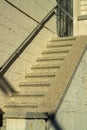 Specled stairway entrance front door stoop or steps cement and metal hand rail with bricks and facades in neighborhood