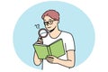 Spectacled man reading book using magnifying glass. Royalty Free Stock Photo
