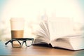 Spectacles, coffee and book