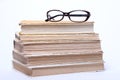 Spectacles lying on old book Royalty Free Stock Photo