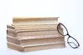 Spectacles lying on old book Royalty Free Stock Photo