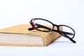 Spectacles lying on old book Royalty Free Stock Photo