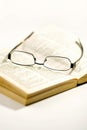 Spectacles on an opened book