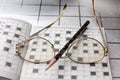 Spectacles, pencil, crossword Royalty Free Stock Photo