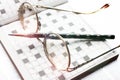 Spectacles, pencil, crossword Royalty Free Stock Photo