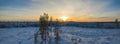 Spectacular Aerial Footage Of Sunset over Snow Covered Forest Landscape In Northern Sweden, clear transparent frosty air. Sun just Royalty Free Stock Photo