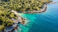 Spectacular aerial sea landscape of rocky coast and crystal clear water. Royalty Free Stock Photo