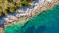 Spectacular aerial sea landscape of rocky coast and crystal clear water. Royalty Free Stock Photo