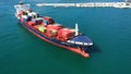 Spectacular aerial view of the bow of a container ship maneuvering upon arrival in port.