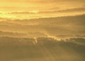 Spectacular aerial view of hills silhouettes and misty valleys