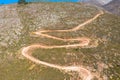 Drone photography from the winding country road to the top of Attavyros Mountain. Rhodes Island, Greece. Royalty Free Stock Photo