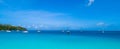 Spectacular aerial view of some yachts and small boats floating on a clear and turquoise sea, Seychelles in the Indian Ocean.Top Royalty Free Stock Photo