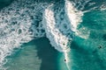 Spectacular aerial view of a surfer taking on waves in a blue ocean Royalty Free Stock Photo