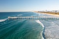 Spectacular aerial view of a surfer taking on waves in a blue ocean Royalty Free Stock Photo