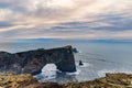 A spectacular arch cut through cliffs by the Atlantic Ocean Iceland Royalty Free Stock Photo