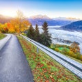 Spectacular autumn view of lake meadows trees and mountains in Sell Am See