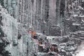 Spectacular basaltic columns background with stream in Iceland Royalty Free Stock Photo