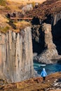 Spectacular basaltic columns and river canyon with blurred tourist Royalty Free Stock Photo