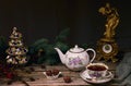 Spectacular Christmas teapot and tea cup, sweets in a ceramic plate, Christmas tree branches, ceramic Christmas tree and an