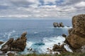 Spectacular coastal landscape with steep cliffs and rock formations carved out by the wave action of the Cantabrian Sea Royalty Free Stock Photo