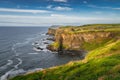 Spectacular coastline, Dunluce Castle located on edge of the cliff, Northern Ireland Royalty Free Stock Photo