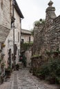 Spectacular colorful traditional italian medieval alley in the historic center of beautiful little town of Spello Perugia Royalty Free Stock Photo