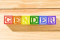 Spectacular colorful wooden cubes with the colors of the LGBTQ gay pride flag with the word gender