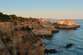 Spectacular colors of the limestone rocks at sunset. Algarve region, Portugal Royalty Free Stock Photo