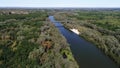 Aerial photography of the river at dawn. Rising mist from the river against the background of the rising sun